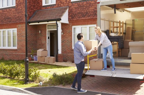Moving day in Hammersmith showing a removals team outside an apartment building