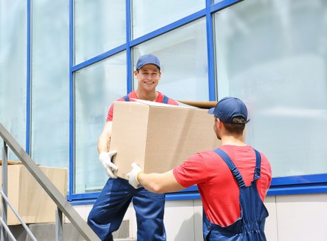 Man and van team loading items for a booked service