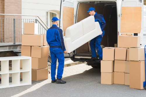 Hammersmith removal van transporting furniture on a busy West London road