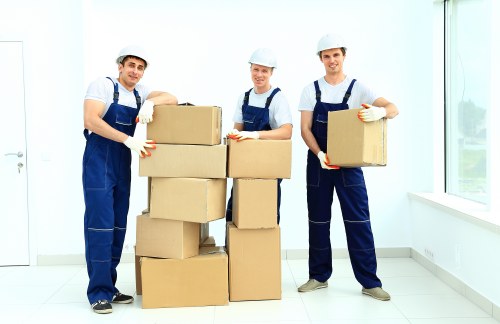 Professional office movers transporting furniture in West London
