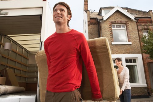 Removal van and moving team planning a house move in Hammersmith