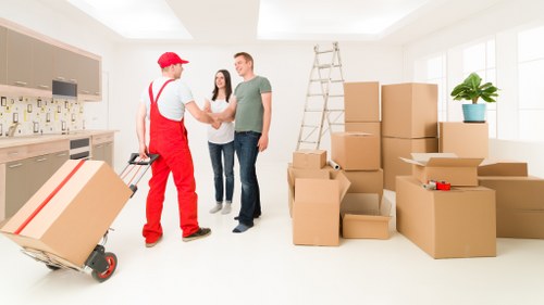 Student furniture being carried from a shared house in Hammersmith
