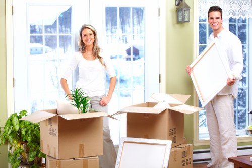 Trained moving staff using protective equipment during a Hammersmith relocation