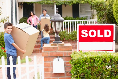 Careful handling of packed household items during a local move in Hammersmith